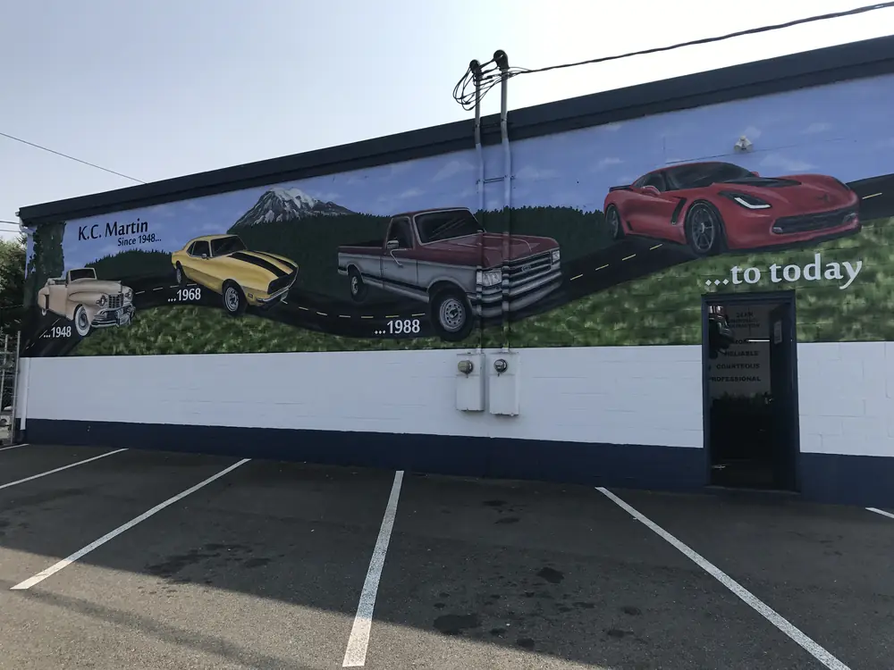 The mural on the side of the KC Martin shop in Lynnwood, showing cars from 1948 to today